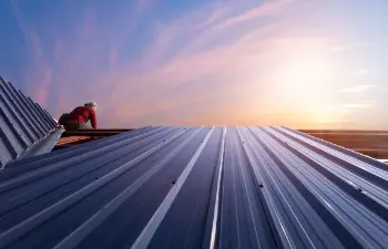 Construction worker installing new roof